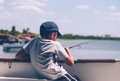 Boy Fishing off Pier