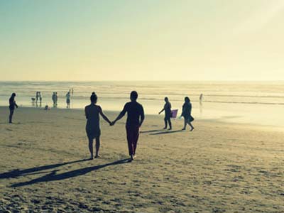 Couple Walking on Beach