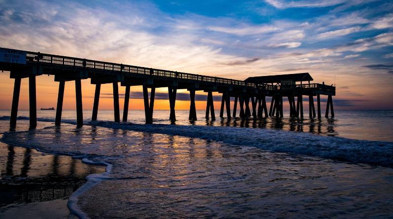 Tybee Pier at Sunrise with Waves Crashing