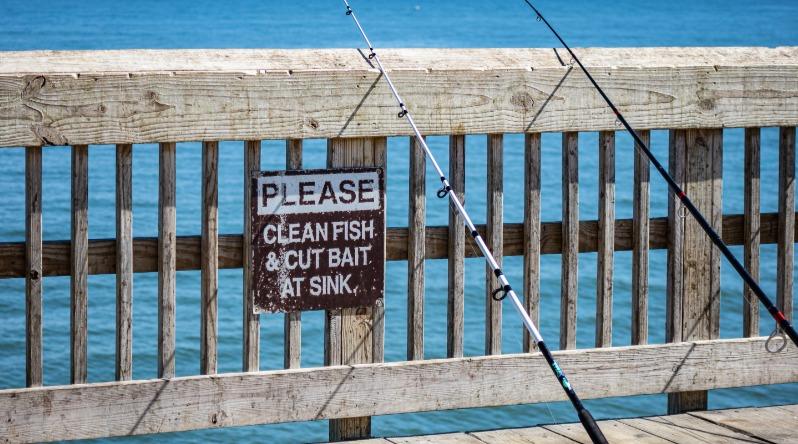 Fishing Poles Leaning On Pier